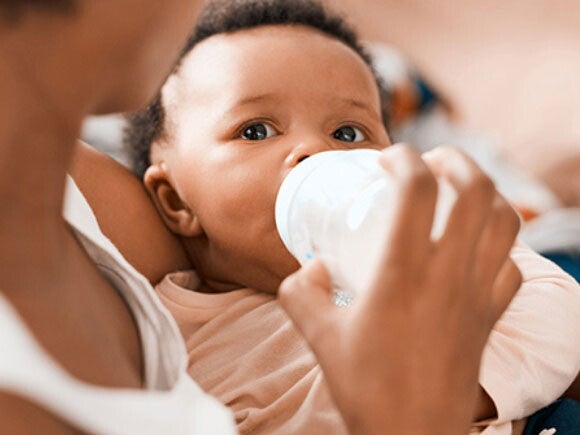 Mom bottle feeding her baby