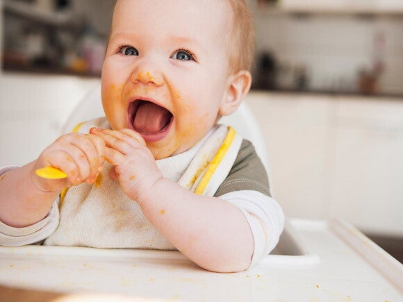Baby at the feeding table Baby at the feeding table
