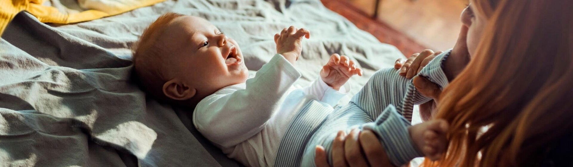Mom kissing baby's toe Mom kissing baby's toe