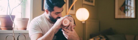 Dad bottle feeding his baby Dad bottle feeding his baby